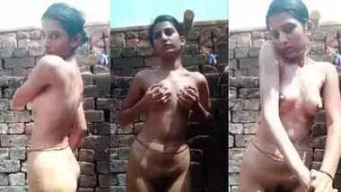 Indian nude girl baths in an open area